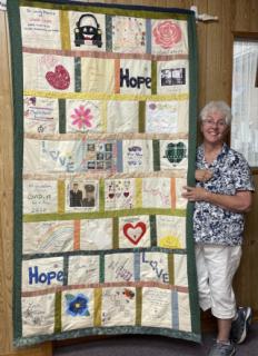 Jane Hill with the completed Celebration of Life Quilt
